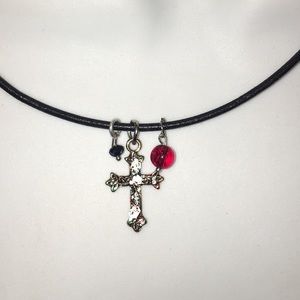 Cross charm necklace on black leather rope chain